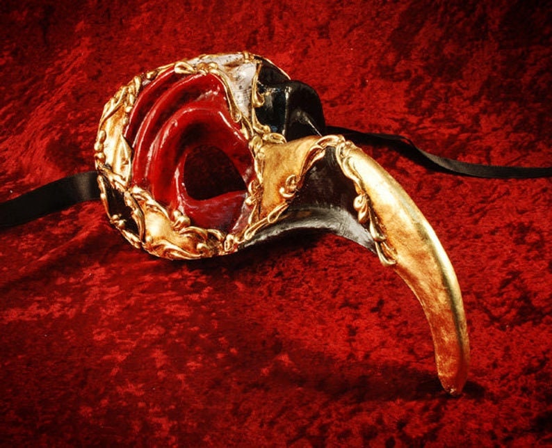 Venetian nose mask Doctor of the Plague. Venice Carnival. Halloween mask in gold leaf.