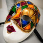 Máscara veneciana Arlequín multicolor con pan de oro. Máscara del carnaval de Venecia. Para bailes de máscaras y fiestas.