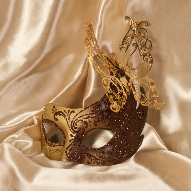 Word. Venetian mask in papier-mâché, made by hand. Decorated with fine trimmings, pearls, metal filigree and Swarovski stones. Marcella.