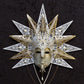 Máscara veneciana realizada con papel maché. Decorado con pasamanería, perlas, filigrana metálica y piedras semipreciosas de Swarovski.Marcella.