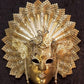 Venetian mask in papier-mâché, made in artisan form. Decorated with fine trimmings, pearls, metal filigree and Swarovski stones. Marcel